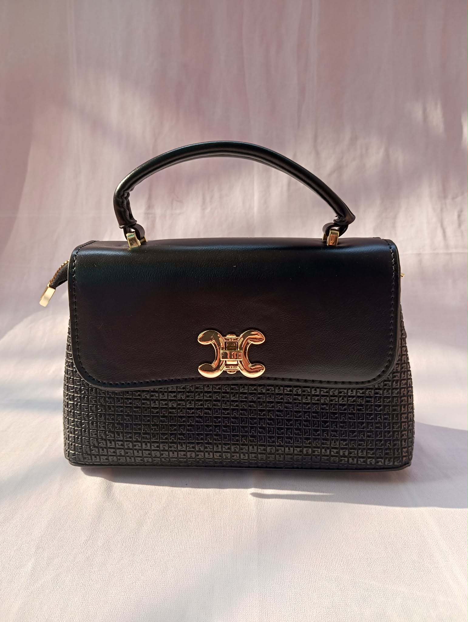 Premium Black Handbag with Gold Lock Closure