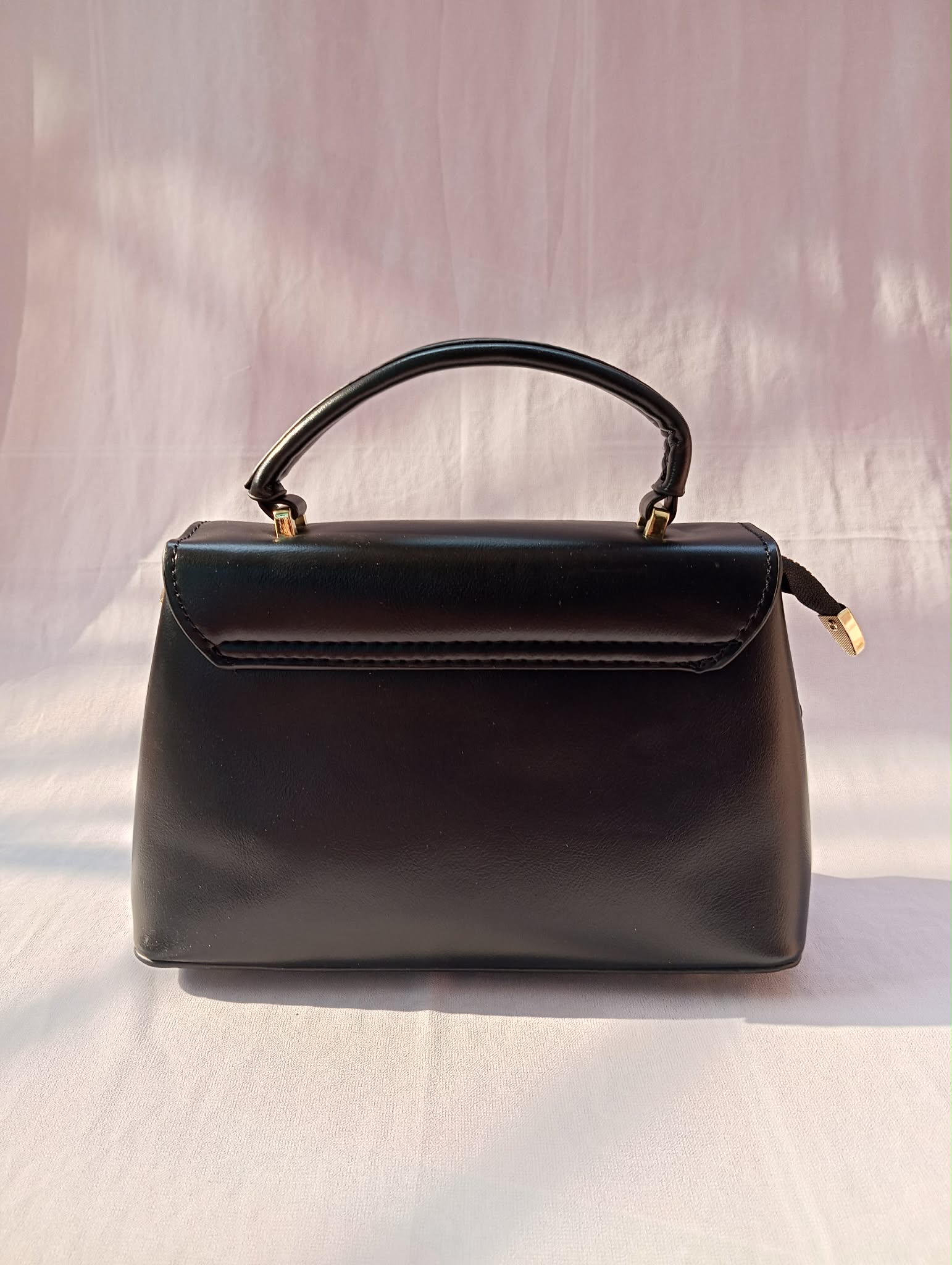 Premium Black Handbag with Gold Lock Closure - Image 4
