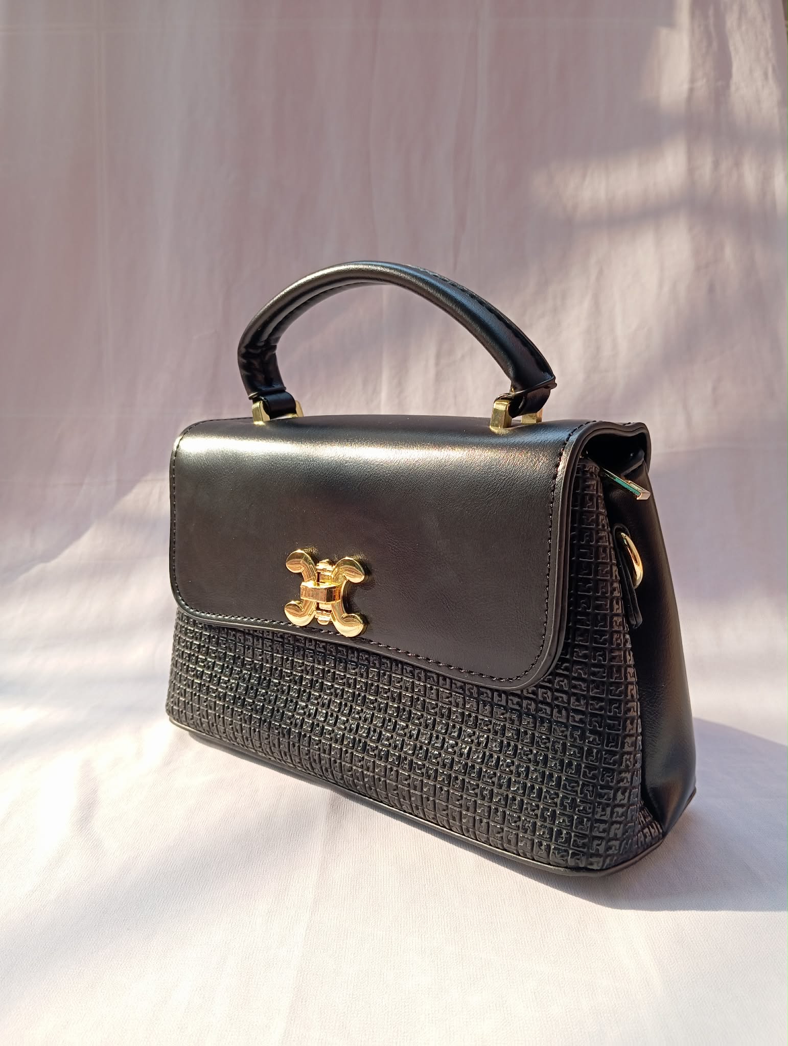 Premium Black Handbag with Gold Lock Closure - Image 3